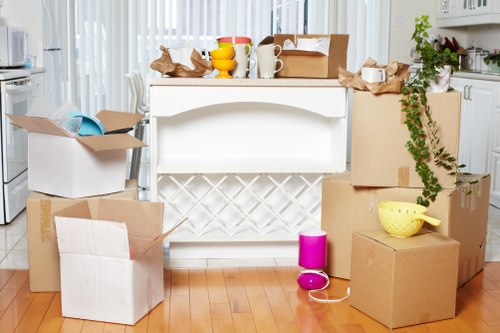 Fragile household items being carefully wrapped by packing professionals in Turnpikelane